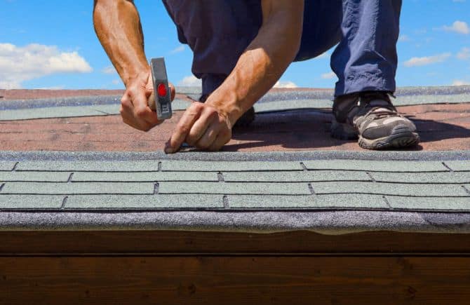 Picture of roofing contractor working.